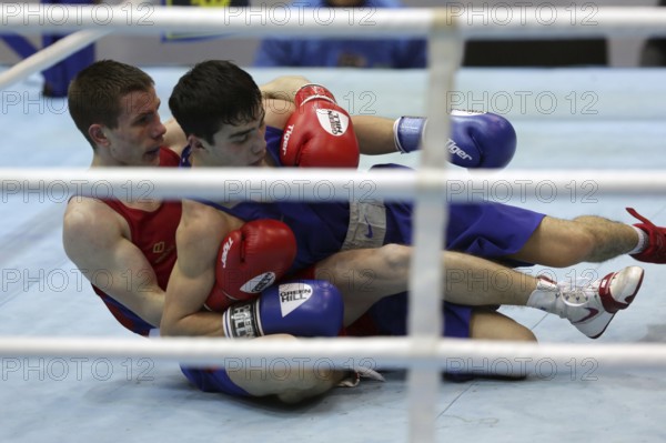 Sofia, Bulgaria - 26 February, 2021: Dorin Bucsa (red) of Moldova and Biibars Zheksen of Kazakhstan fight in their semifinal round of Feather (57kg) category of the 72-nd International Boxing Tournament Strandja 2021, Sofia, Bulgaria, Europe