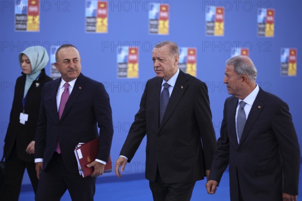 Spain, Madrid - 30 June, 2022: Turkish President Recep Tayyip Erdogan (C) and Turkish Foreign Minister Mevlut Cavusoglu (L) attend the NATO summit in Madrid, Spain, Europe