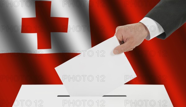 The Tonga flag and the hand with the bulletin about the ballot box