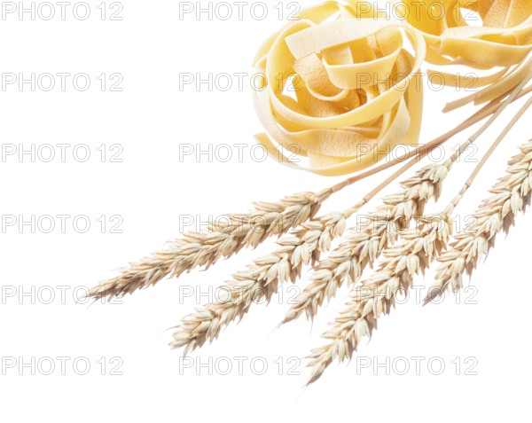 Wheat ears rolled pasta isolated on white