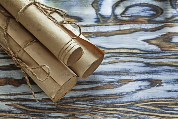 Medieval corded paper scrolls on wooden board