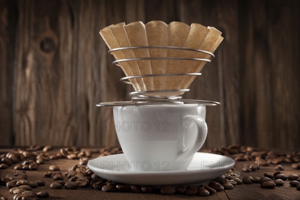 Alternative Coffee Brewing. Corded Paper Filter Holder On White Ceramic Coffee Cup. Coffee Beans On Vintage Wooden Background