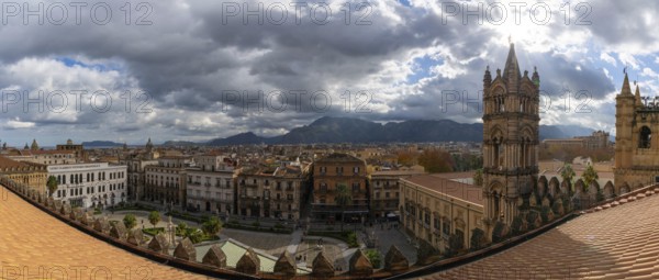 A panorama view over the rooftops of downtown Palermo with the cathedral bell tower in the foreground