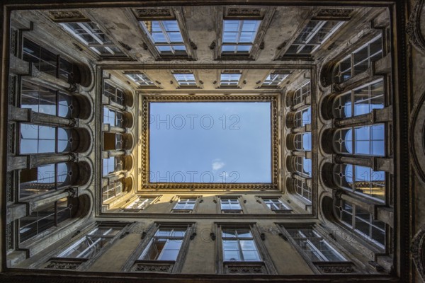 Old building in a historic city centre in Eastern Europe. Courtyards or backyards in typical architectural style. Urban life in Budapest, Hungary, Europe