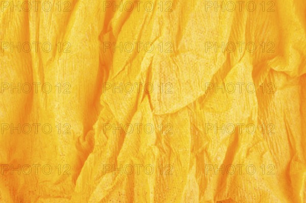 Background of orange old crumpled paper