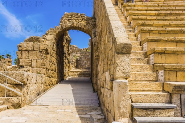The fragment of protective walls. The oldest amphitheater in Israel. Ruins of the ancient city of Caesarea. Concept of archeological and historical tourism