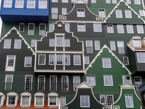 Detail of modern green hotel building as with many stacked small traditional buildings of Inntel Hotels Amsterdam Zaandam in a modern part of the city centre, Zaandam, North Holland, Netherlands