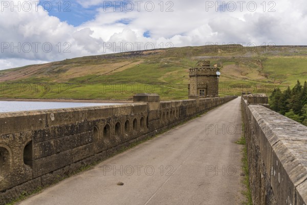 Near Middlesmoor, North Yorkshire, England, UK, May 19, 2019: The road over the dam of the Scar House Reservoir