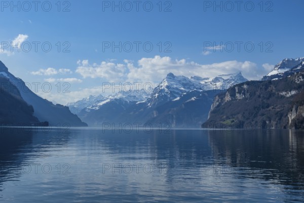 Lake Vierwaldstaettersee, surrounded by snow covered mountains, seen from Brunnen, Switzerland, on a beautiful spring day, Europe