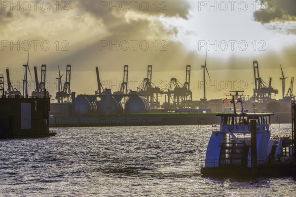Amazing landscape, An engineering ship (tugboat) and docks in Hamburg, yellow sunset. October in Northern Germany