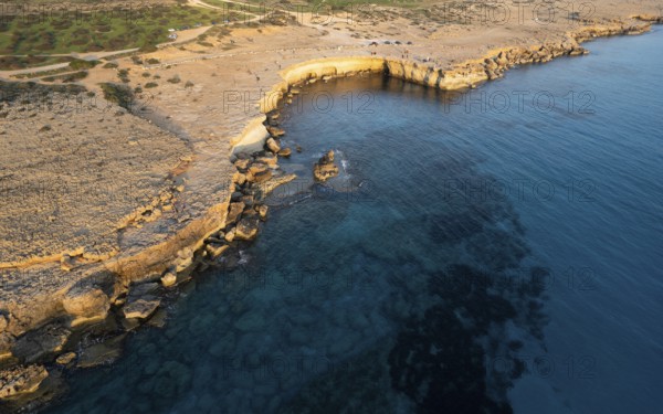 Done scenery of Cape Greko or Cape Greco sea caves Ayia Napa Cyprus. Tourist people doing sightseeing