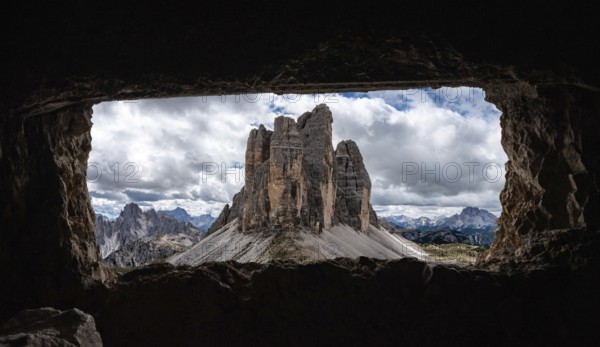 View out of an old military tunnel window towards the iconic Three Peaks mountain in the Dolomite Alps, former Austrian-Italian front in the First World War, Autonomous province of South Tirol