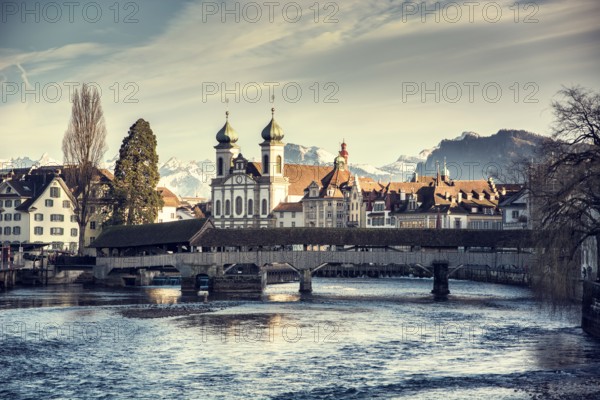 Scenic view on wooden bridge in Lausanne, Switzerland. Mountains and sky with clouds on background