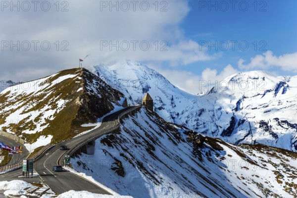 Austrian Alps. The snow on the mountainside began to melt. Dizzy turns of mountain serpentine. Gorgeous Grossglocknerstrasse. The concept of active, ecological and photo tourism