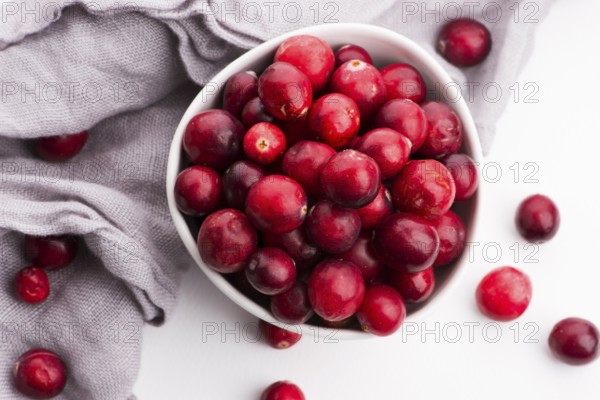 Ceramic bowl of Cranberry on white background