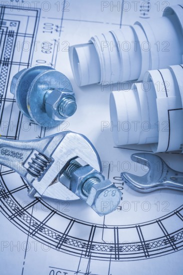 Adjustable key spanner bolts nuts and construction plans maintenance concept