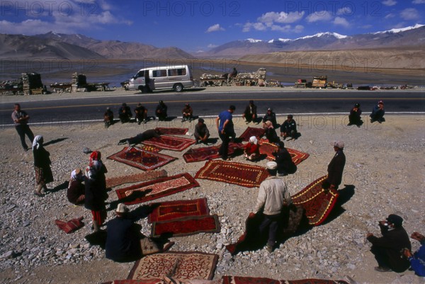 Two small settlements of Kirghiz (Kyrgyz or Kirgiz) nomads lie by the side of Lake Karakul high up in the Pamir Mountains. Visitors can stay overnight in one of their mobile homes or yurts – Kirghiz men will approach travellers as they arrive at the lake and offer to arrange this accommodation. The Kyrgyz form one of the 56 ethnic groups officially recognized by the People's Republic of China. There are more than 145, 000 Kyrgyz in China.<br/><br/> The Zhongba Gonglu or Karakoram Highway is an engineering marvel that was opened in 1986 and remains the highest paved road in the world. It connects China and Pakistan across the Karakoram mountain range, through the Khunjerab Pass, at an altitude of 4, 693 m/15, 397 ft