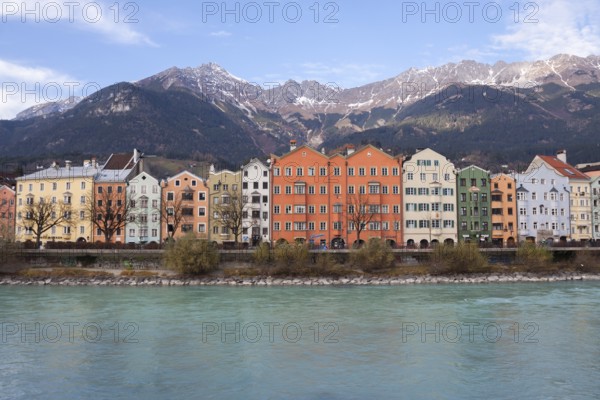 View of colorful houses across the Inn River. Innsbruck, Tyrol. Austria