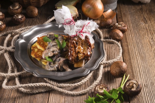 Grilled ribs with potato pancakes