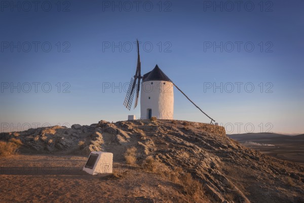Don Quixote windmills at sunset. Famous landmark in Consuegra, Toledo Spain
