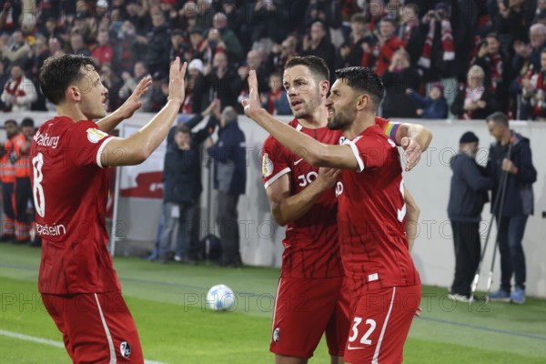 Vincenzo Grifo (SC Freiburg) scores from the penalty spot to make it 2-0 at the break and celebrates his goal with colleagues Maximilian Eggestein (SC Freiburg) and Christian Günter (SC Freiburg) during the DFB Cup 2024-25, 2nd round match: SC Freiburg vs Hamburger SV, Freiburg im Breisgau, Germany / Germany