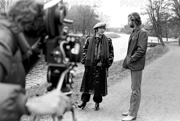 Elton John. English singer, songwriter born march 25 1947. Pictured wearing a chequered cap and a matching chequered scarf during a visit to Sweden 1978