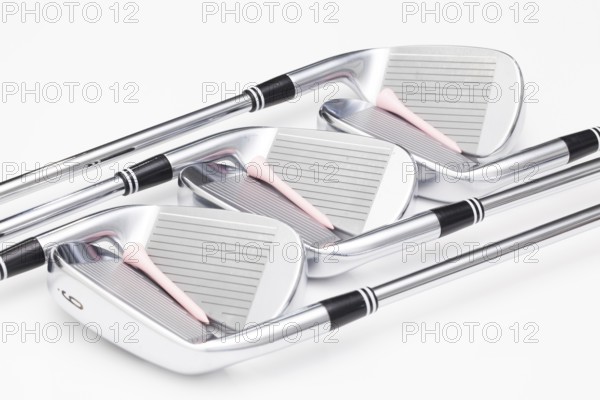 Titanium golf clubs on the white background