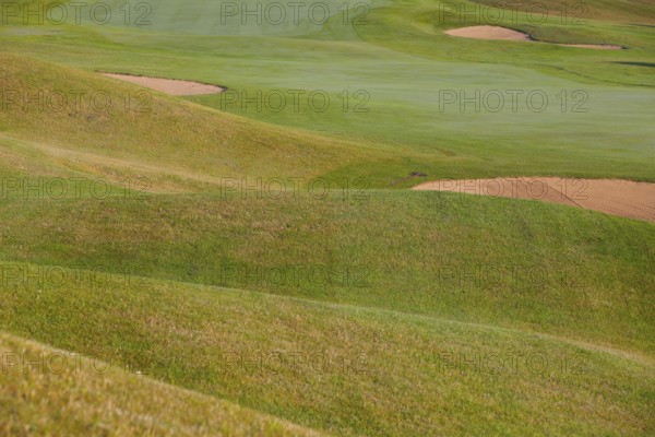 Summer golf course with different bunkers