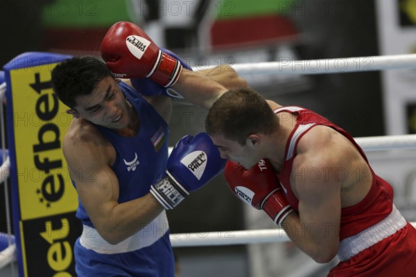 Sofia, Bulgaria. 27th February, 2021. Ruslan Kolesnikov (red) of Russia and Dilshodbek Ruzmetov of Uzbekistan fight in their final round of Light Heavy (81kg) category of the 72-nd International Boxing Tournament Strandja 2021, Sofia, Bulgaria, Europe