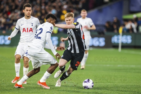 MELBOURNE, AUSTRALIA, MAY 22: Emerson Royal of Tottenham Hotspur and Lewis Hall of Newcastle United tussle for the ball during the Global Football Week at The Melbourne Cricket Ground on May 22, 2024 in Melbourne, Australia, Oceania