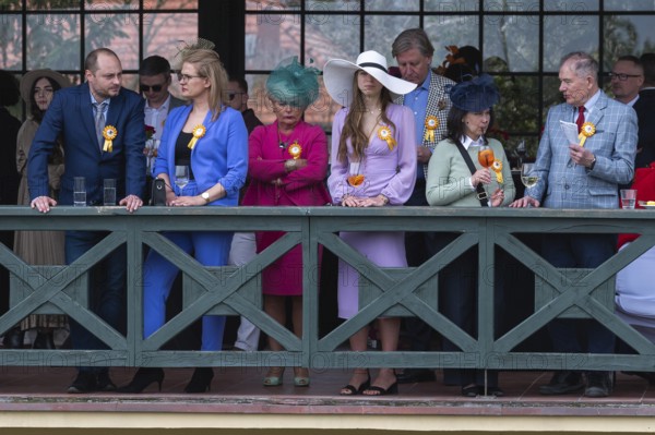 WROCLAW, POLAND - APRIL 23, 2023: Horse racing - opening of the Season at the racecourse WTWK Partynice. People on the VIP tribune.