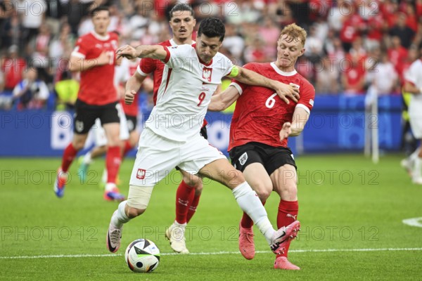 BERLIN, GERMANY - JUNE 21, 2024: Euro 2024 Groupe D match Poland vs Austria 1:3. In action Robert Lewandowski (L) Nicolas Seiwald (R).