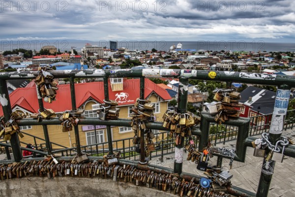 Love locks on a fence, viewpoint over Punta Arenas, Patagonia, Chile, South America