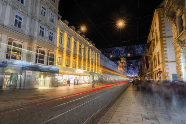 Advent atmosphere, Christmas illuminated Herrengasse, light tracks of a tram, Graz, Styria, Austria, Europe