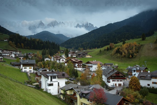 Picturesque village of Val di Funes with the dolomite rocky mountains in Italy at night