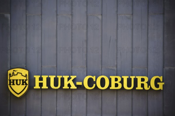 Mainz, Germany - July 06, 2017: The yellow company sign and logo of the insurance company HUK Coburg on a sheet metal facade of an office building on 06 July 2017 in Mainz