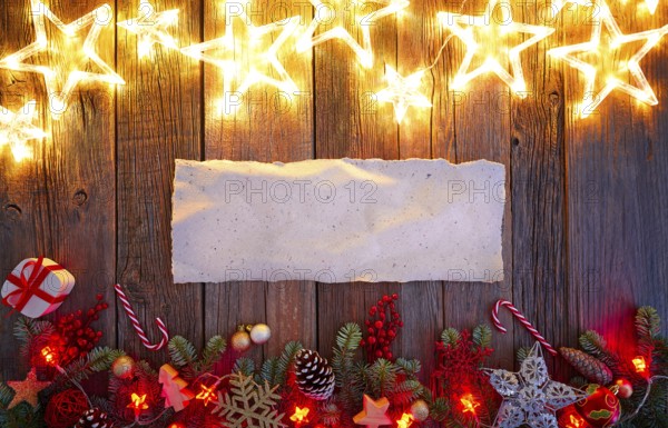 Christmas glow stars and fir white paper parchemin copy space on vintage wood