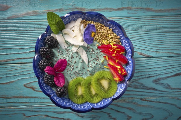 Acai bowl smoothie with kiwi blackberry strawberry and chia seeds