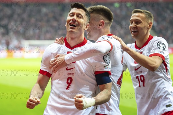 WARSAW, POLAND - MARCH 21, 2025: Qualifications for FIFA World Championship 2026. Match Poland - Lithuania 1:0. Joy Robert Lewandowski and Krzysztof Piatek, Przemyslaw Frankowski team of Poland after scoring goal