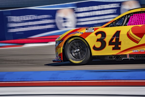 NASCAR Cup Series driver, MICHAEL MCDOWELL (34), races through the turns during a practice session for the Bank of America ROVAL 400 at Charlotte Motor Speedway Road Course in Concord, NC, Concord, United States of America