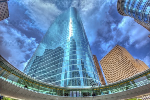 Houston downtown skyscrapers disctict with mirror blue sky reflection