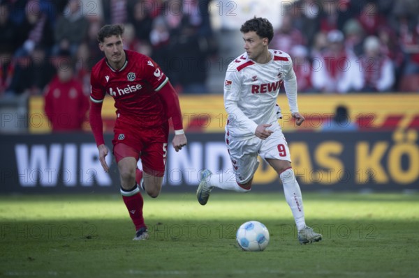 (DFL/DFB REGULATIONS PROHIBIT ANY USE OF PHOTOGRAPHS AS IMAGE SEQUENCES AND/OR QUASI-VIDEO) Cologne, RheinEnergieStadion, North Rhine-Westphalia, Phil Neumann (defence, Hannover 96, #5), Luca Waldschmidt (1.FC Köln, forward, #9), 2nd Bundesliga, 1.FC Köln, Hannover 96 on 30/11/2024 at RheinEnergieStadion in Cologne Germany