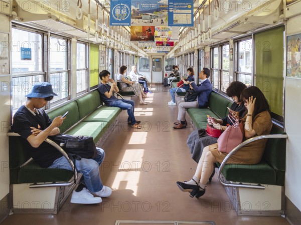 Kyoto, Japan - May 13 2019: People on a train near Sanjo Train Station in Kyoto, Japan, Asia