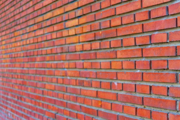 The background of the old red brick wall for design interior and various scenes or as a background for video interviews