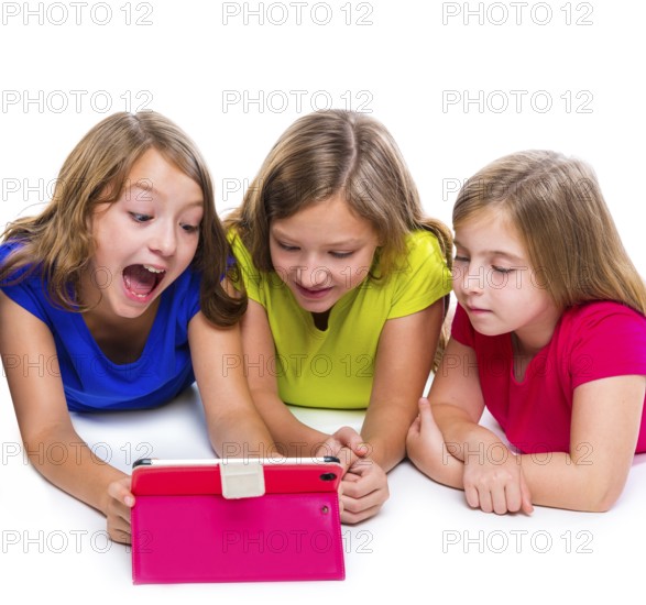 Sisters cousins kid girls with tech tablet pc playing happy lying on white background