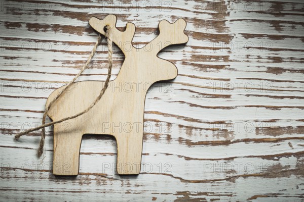 Vintage wooden deer string on wood board celebrations concept