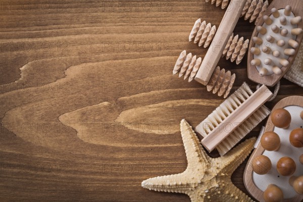 Wisp of bast back massagers starfish and brush on pine vintage board healthcare concept