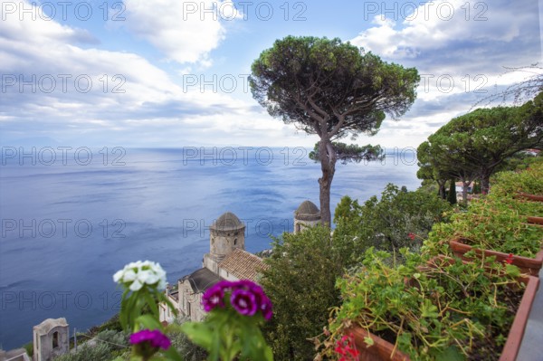 Amazing view from villa ? Rufolo on Mediterranean Sea and some old building and Pine trees (pinia) South Italy. Small white boat in lest side, point in Sea