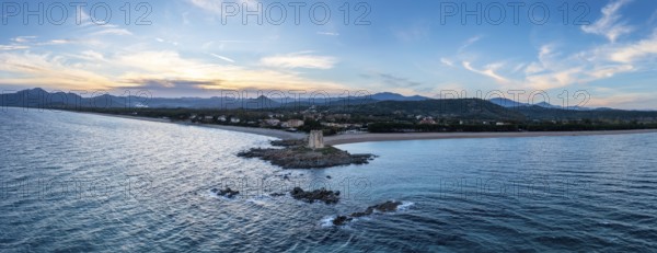 An aerial panorama landscape of the Torre di Barisardo beach on the east coast of Sardinia at dusk