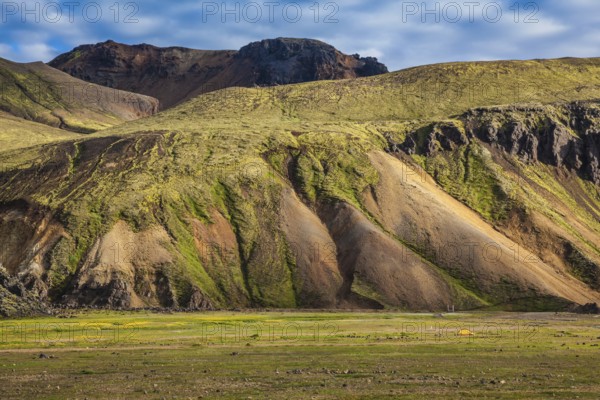 Multicolored rhyolite mountains surround the valley. Summer morning in the National Park Landmannalaugar, Iceland, Europe